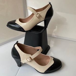 Worn once. Vintage style, wingtip Mary Jane pumps.